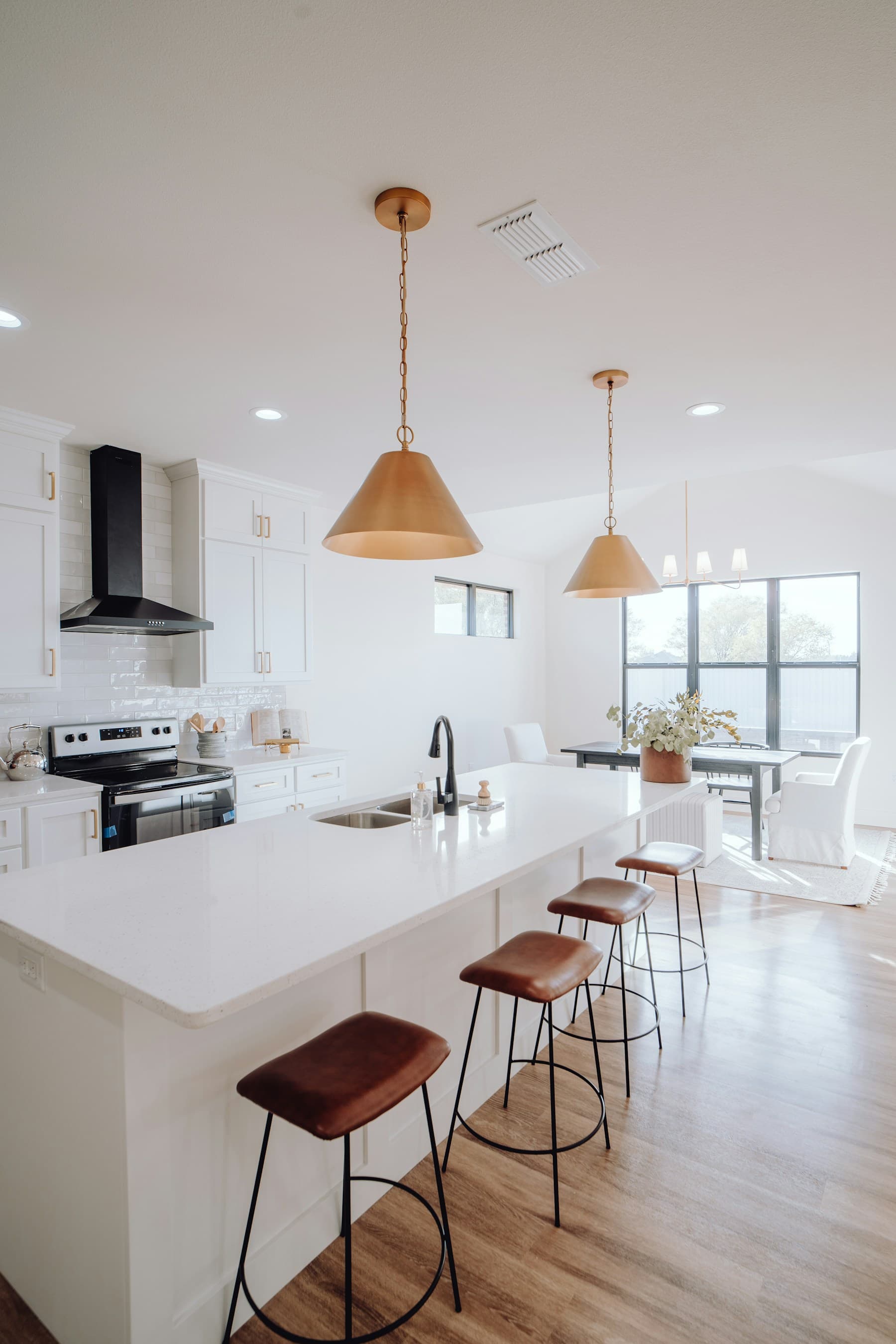 Installed Oakway kitchen with cabinets, countertops, and island seating
